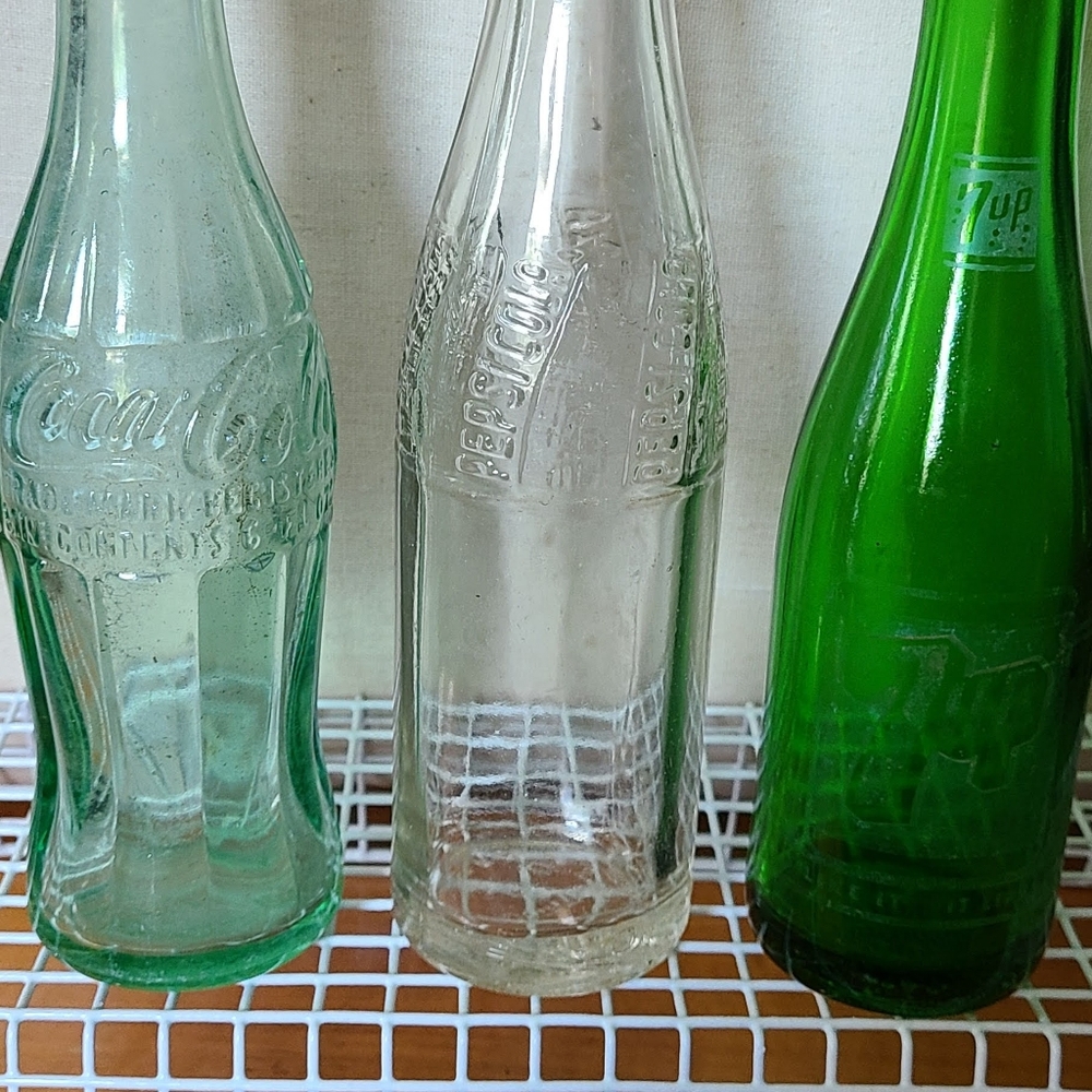Lot of 3 Soda Bottles, 7 Up, Pepsi  and Coca Cola